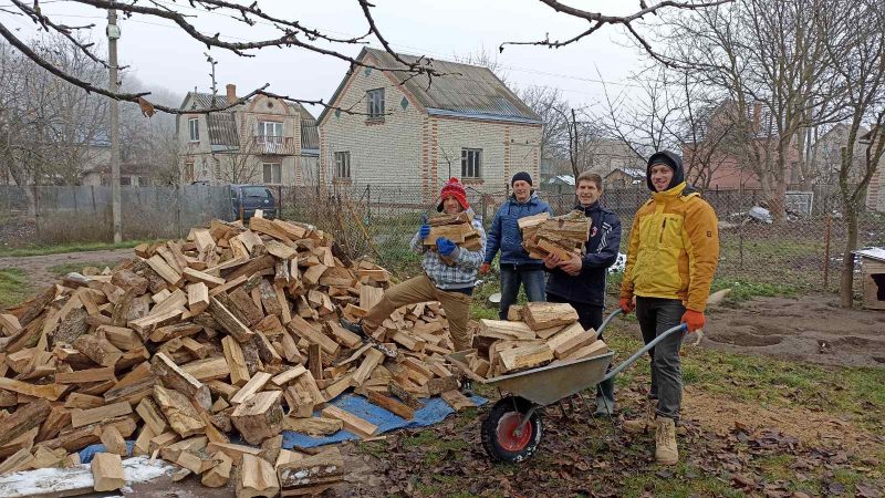 Agape Rehabilitation Center residents and staff gather firewood in the midst of frequent power outages in Ukraine.